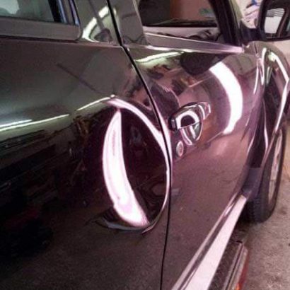 Delle in Fahrzeugtür - Hagelschadenpoint Baunatal - Beulendoktor Kassel